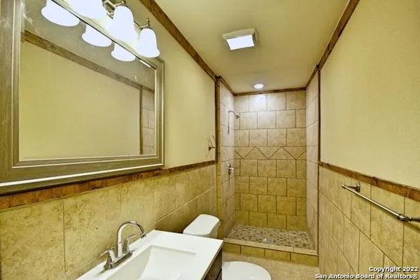 a bathroom with a bathtub and shower