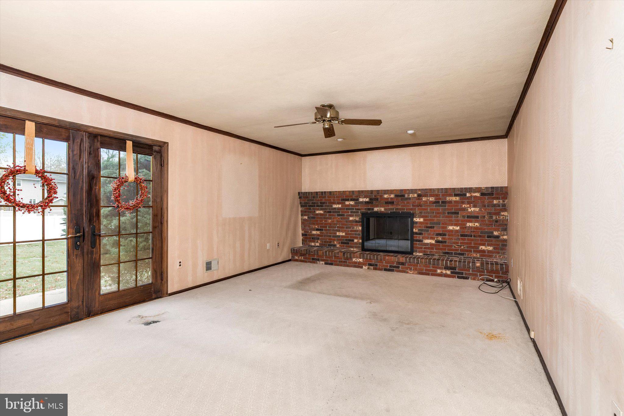 87 Limewood Drive Hamilton, NJ 08690 - Photo 14 of 34 a view of an empty room with a fireplace