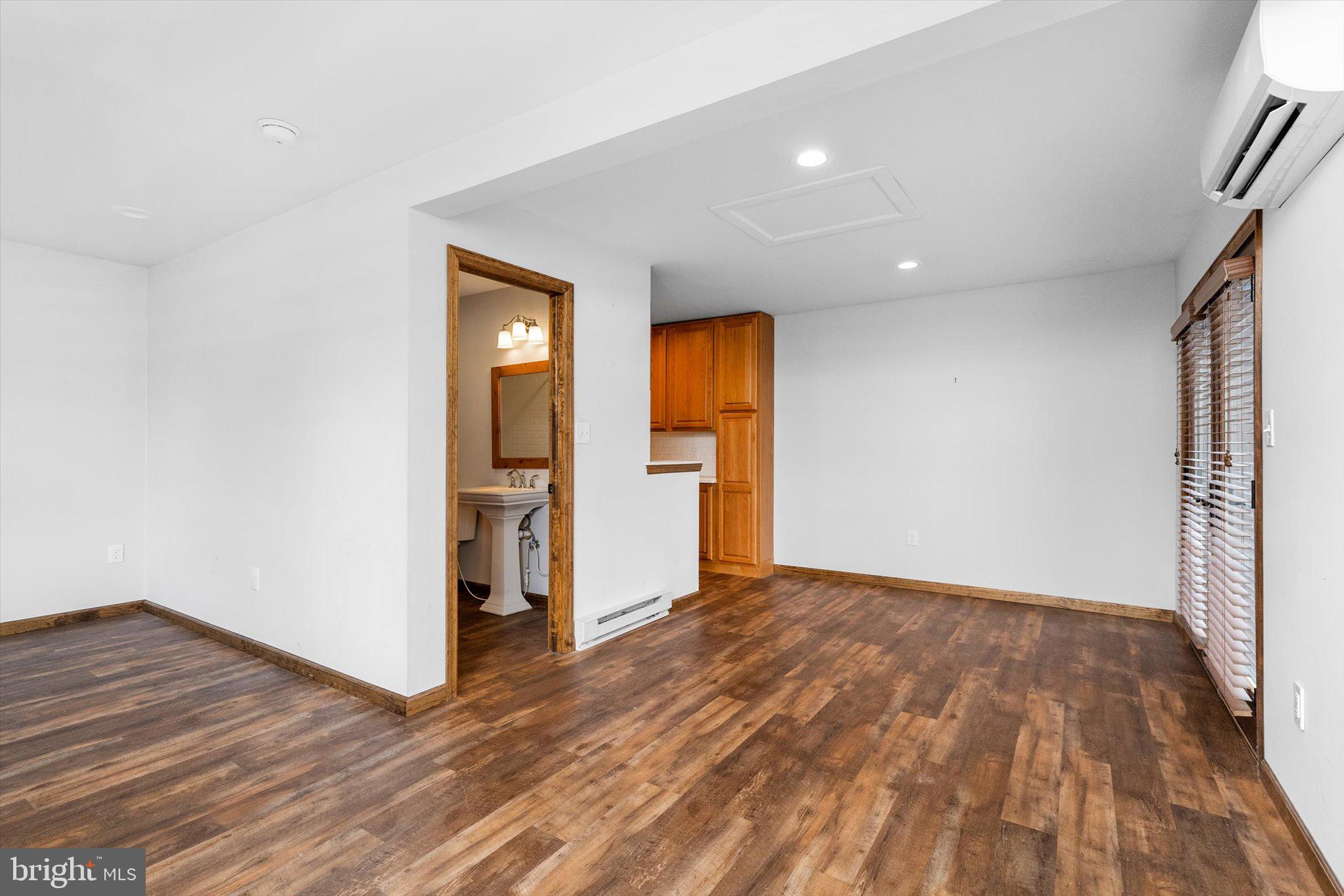 87 Limewood Drive Hamilton, NJ 08690 - Photo 18 of 34 a view of an empty room with wooden floor and a window