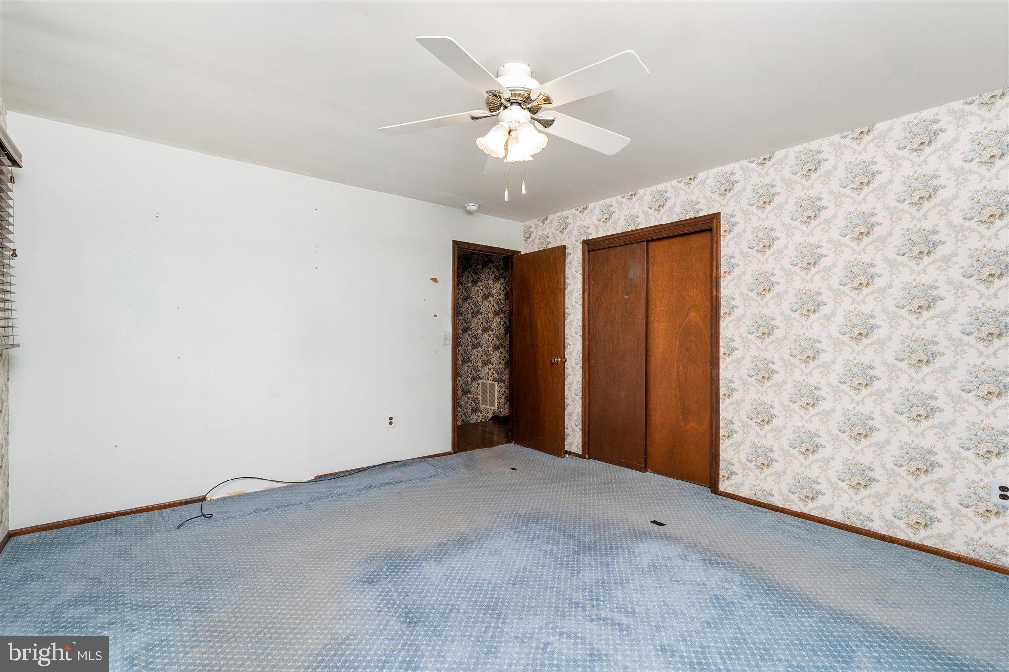 87 Limewood Drive Hamilton, NJ 08690 - Photo 24 of 34 a view of an empty room with a ceiling fan