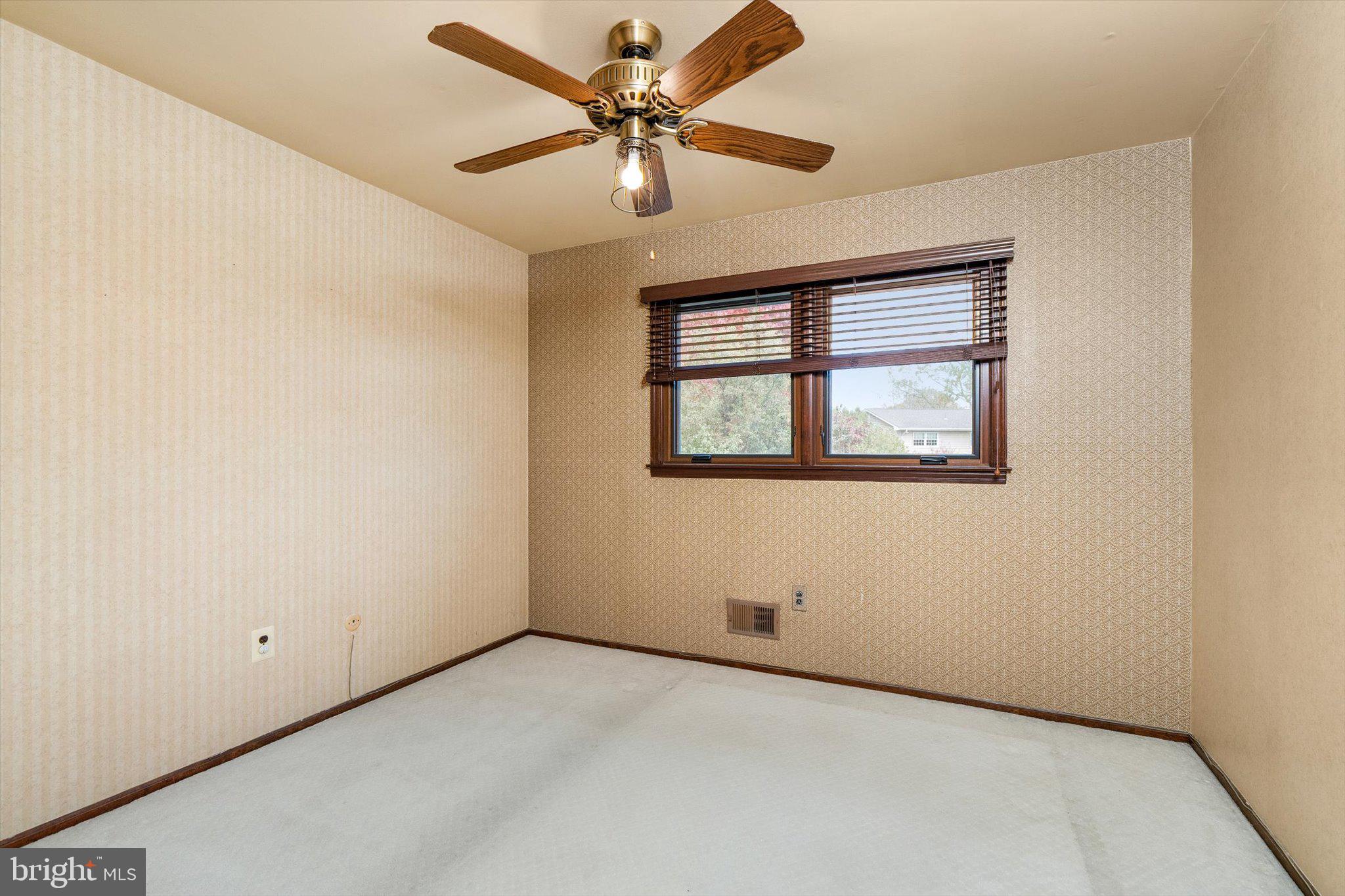 87 Limewood Drive Hamilton, NJ 08690 - Photo 26 of 34 an empty room with a window and a fan