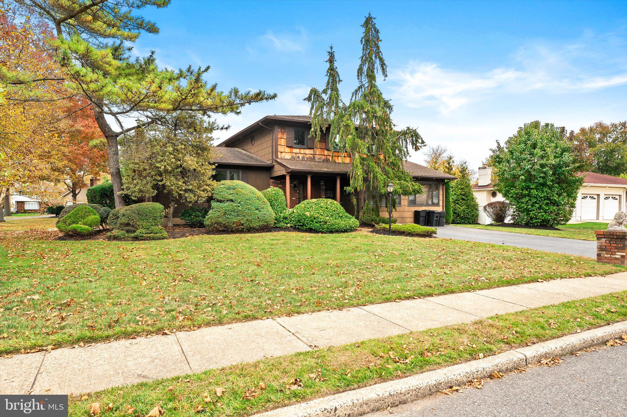 87 Limewood Drive Hamilton, NJ 08690 - Photo 3 of 34 a front view of a house with a yard