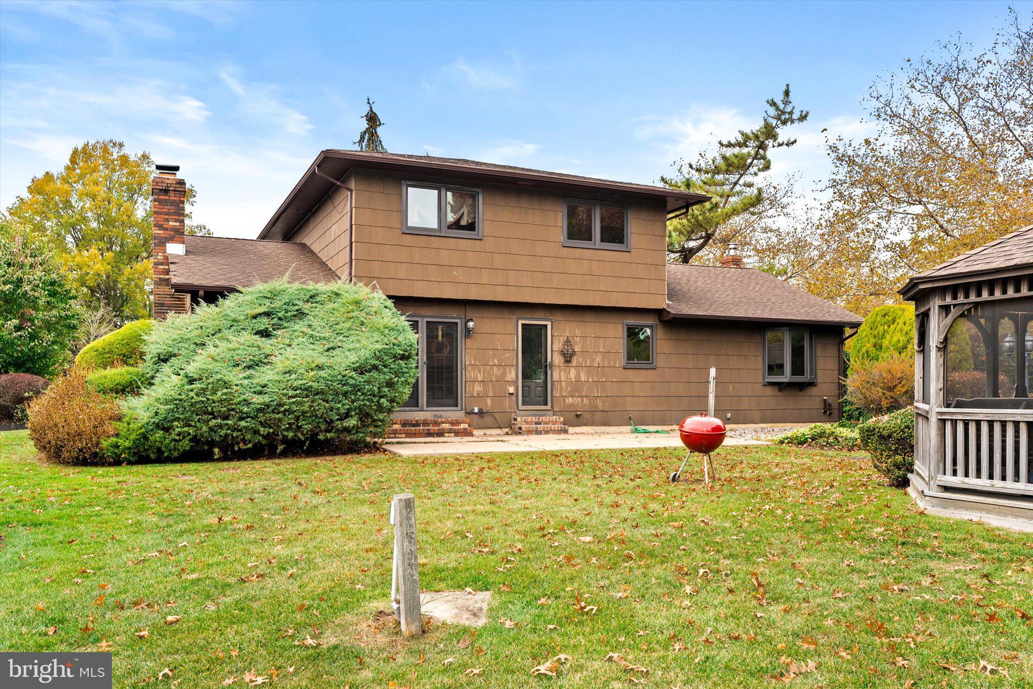 87 Limewood Drive Hamilton, NJ 08690 - Photo 34 of 34 a front view of a house with garden