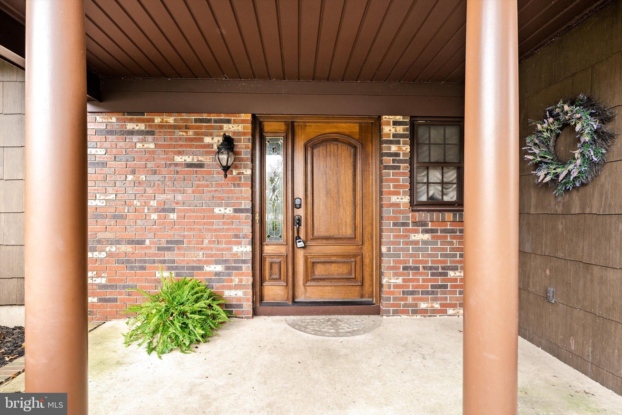 87 Limewood Drive Hamilton, NJ 08690 - Photo 4 of 34 a view of front door of house