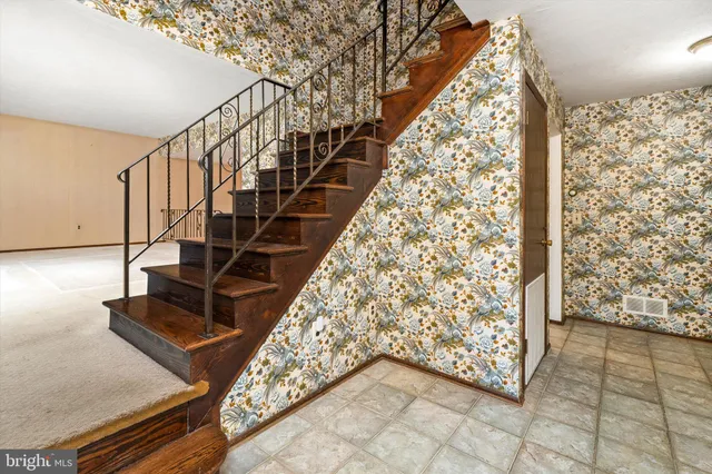 a view of entryway with stairs