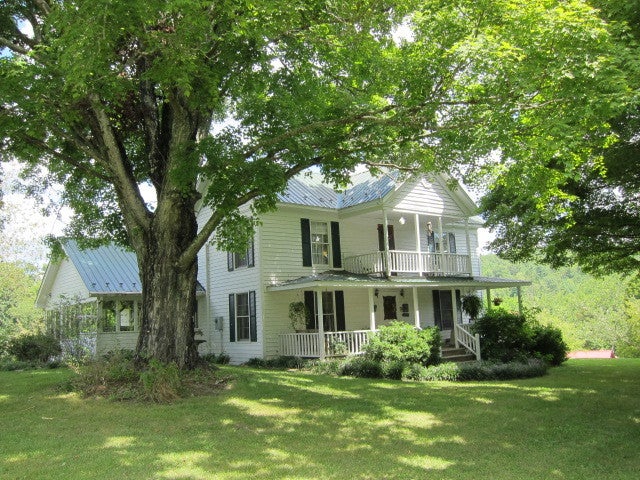 2025 Pete Lynch Road Secondcreek, WV 24974 - Photo 2 of 94 Front view of the home, covered uppper & lower porches.