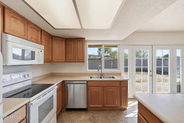 a kitchen that has a sink and a stove