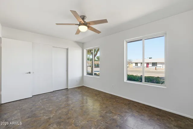 a view of an empty room with a window