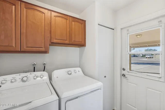 a utility room with dryer and washer