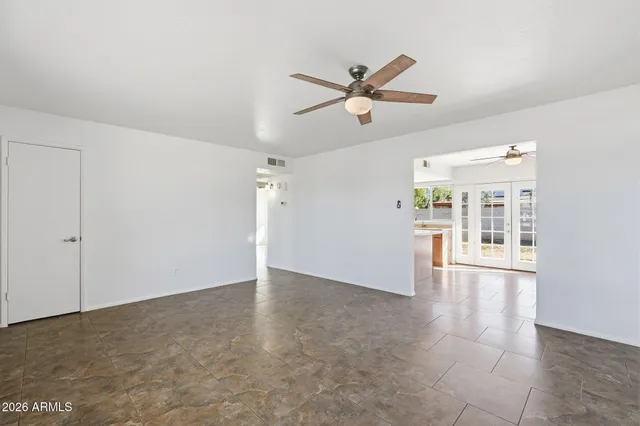 a view of an empty room with a window