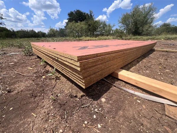 a view of a yard with an outdoor space