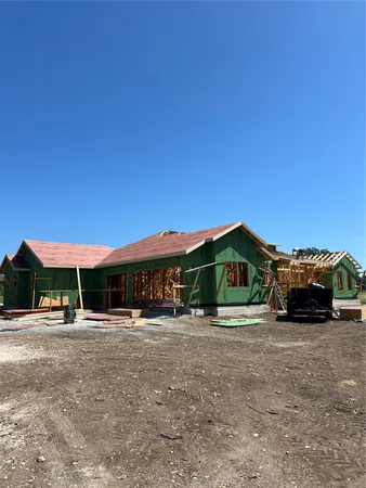 a view of a car park in front of house