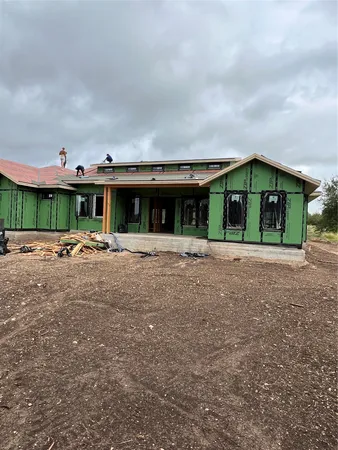 a front view of building with yard