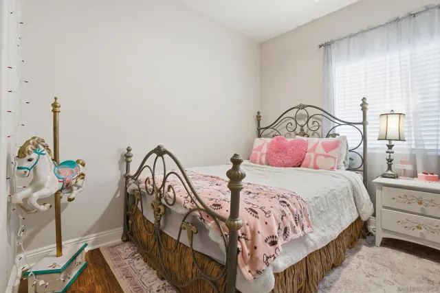 a bedroom with bed and a window