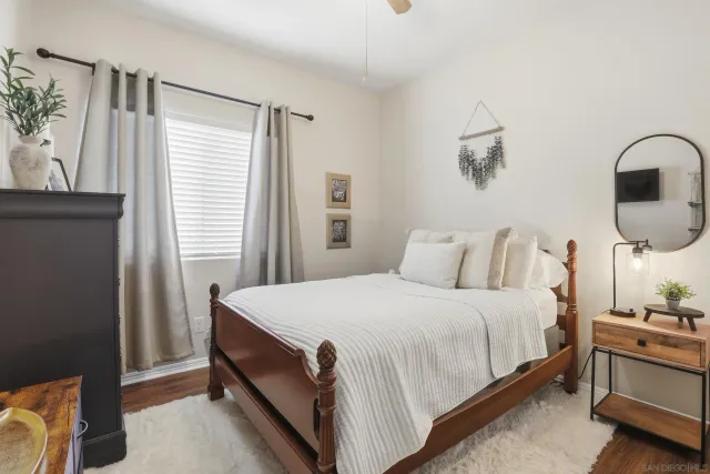 a bedroom with a bed and a window