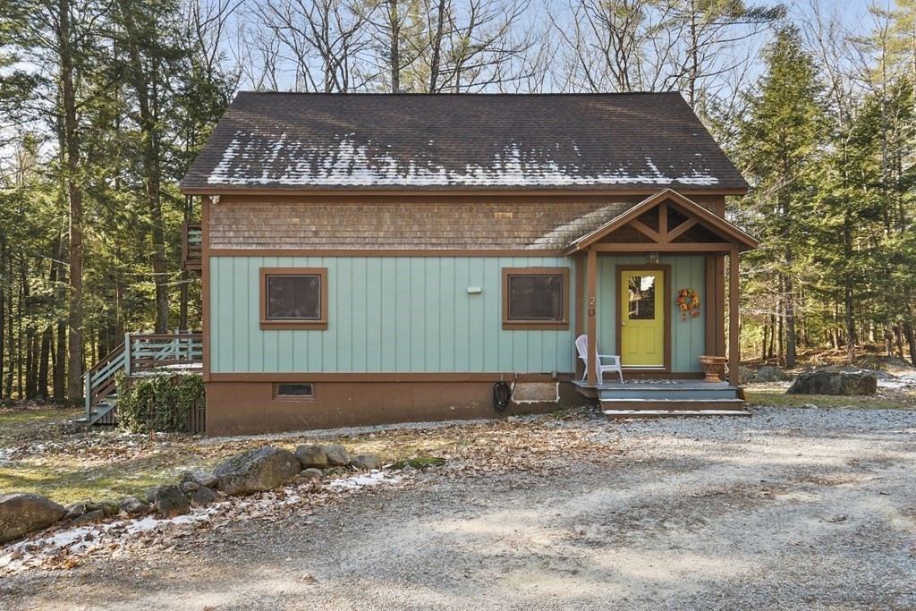 2 Patten Hill Road Hillsborough, NH 03244 - Photo 1 of 36 a front view of a house with a yard