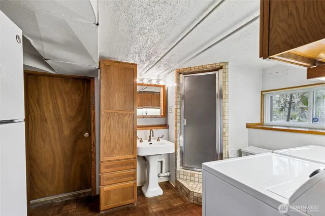 a kitchen with a refrigerator and table