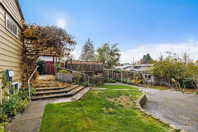 a view of a backyard with sitting area