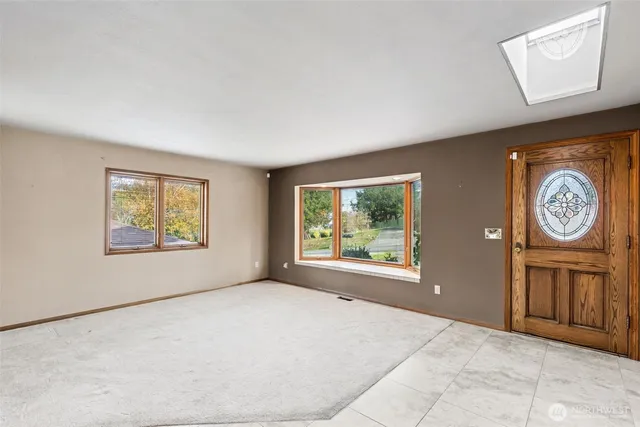 a big room with closet and windows