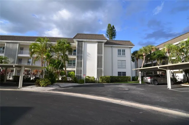 a front view of a house with a street