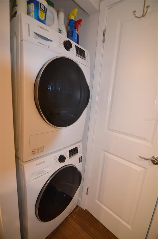 4420 Exeter Drive, Unit 208 Longboat Key, FL 34228 - Photo 13 of 28 a utility room with dryer and washer