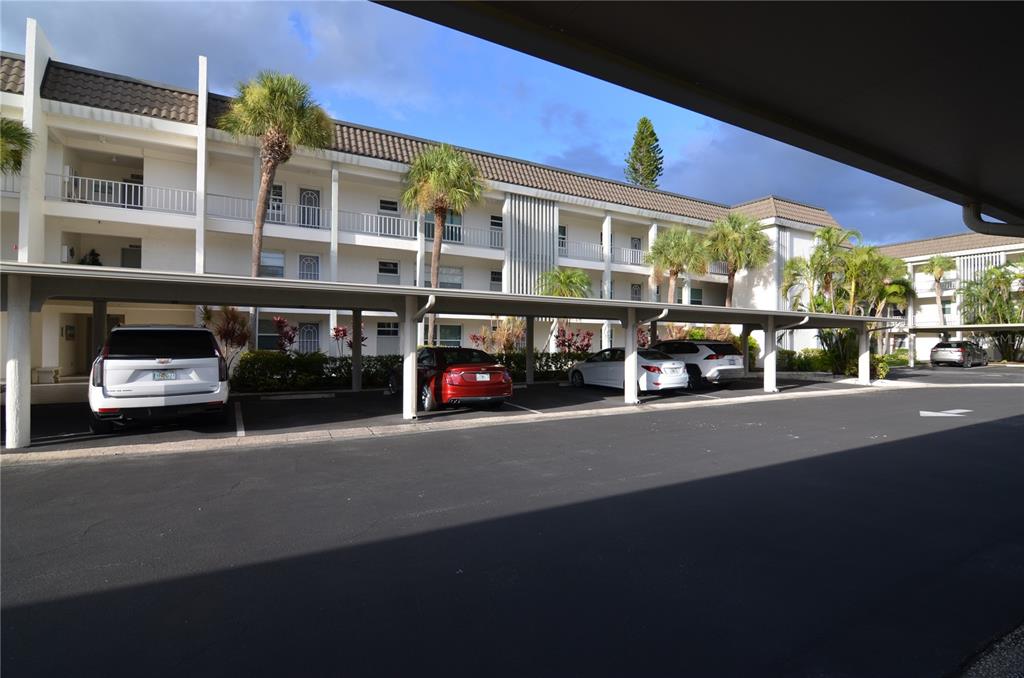 4420 Exeter Drive, Unit 208 Longboat Key, FL 34228 - Photo 2 of 28 a car parked in front of a building