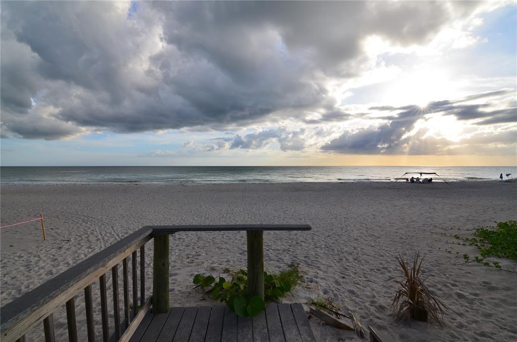 4420 Exeter Drive, Unit 208 Longboat Key, FL 34228 - Photo 26 of 28 a roof deck with table and chairs