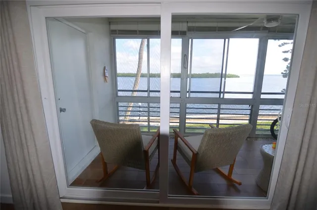 a view of a dining room with furniture and window