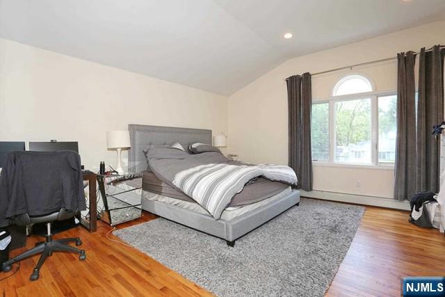 84 12th Street Cresskill, NJ 07626 - Photo 27 of 45 a bedroom with a bed and wooden floor