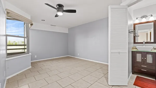 a bathroom with a granite countertop sink mirror and double