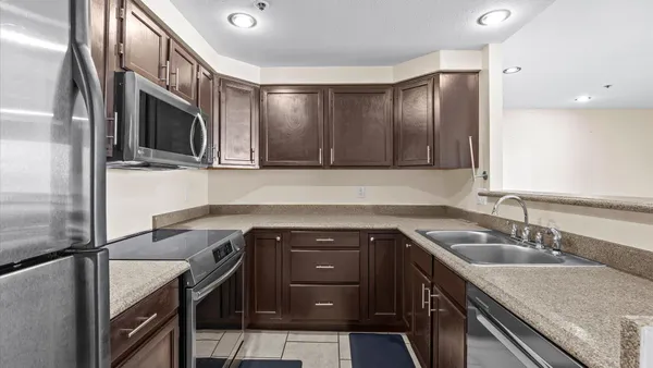 a kitchen with a sink and a window