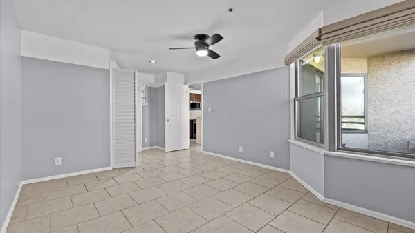 a view of an empty room with a window
