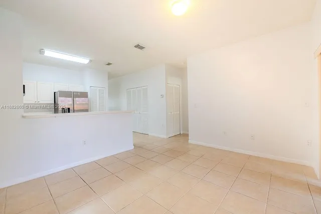 a view of a kitchen with a sink