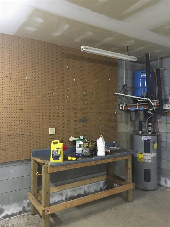 321 Burton Road Advance, NC 27006 - Photo 16 of 29 Basement with a great area for tools and organization