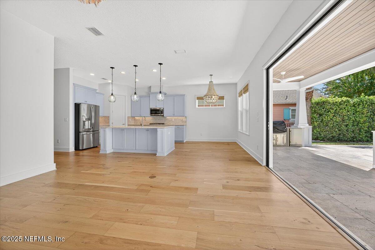 604 Timber Bridge Lane Atlantic Beach, FL 32233 - Photo 12 of 46 a view of a kitchen with stainless steel appliances granite countertop a refrigerator and a sink