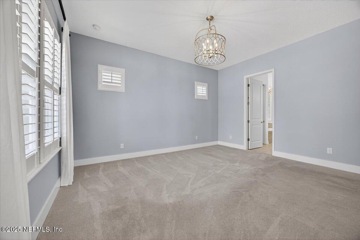 604 Timber Bridge Lane Atlantic Beach, FL 32233 - Photo 16 of 46 a view of an empty room with a window