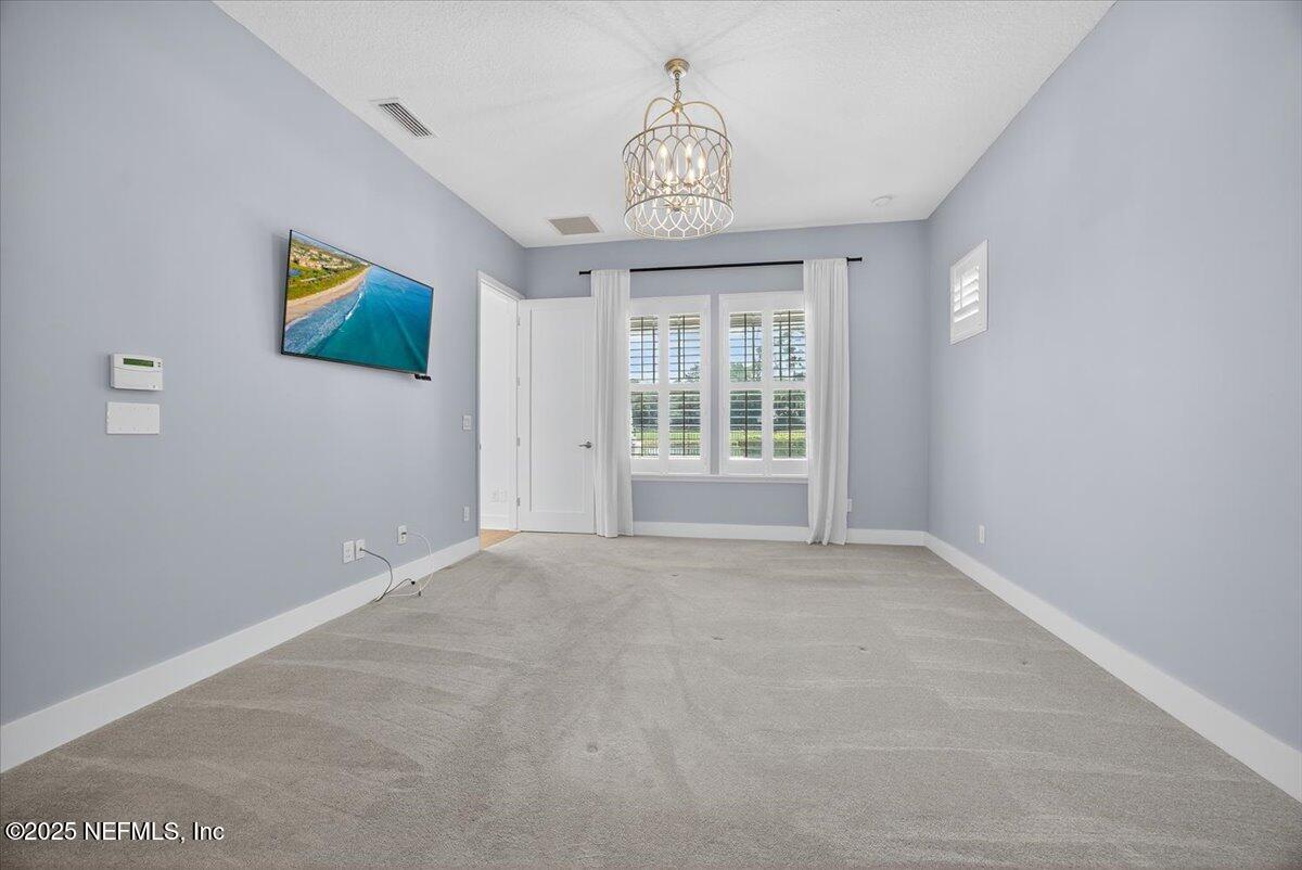 604 Timber Bridge Lane Atlantic Beach, FL 32233 - Photo 17 of 46 a view of an empty room with a window