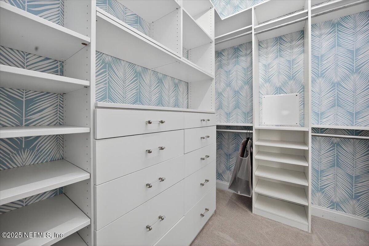 604 Timber Bridge Lane Atlantic Beach, FL 32233 - Photo 21 of 46 a view of walk in closet with empty racks