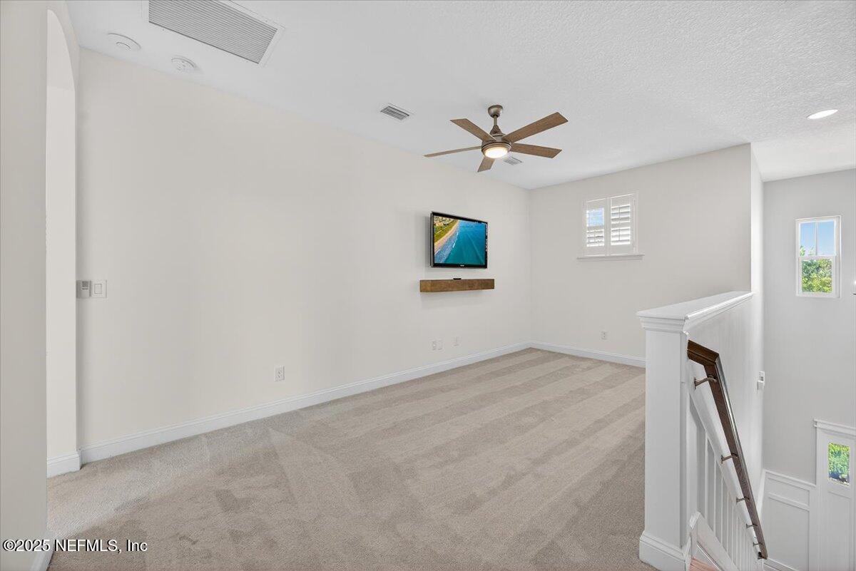 604 Timber Bridge Lane Atlantic Beach, FL 32233 - Photo 22 of 46 a view of a livingroom with a ceiling fan and window