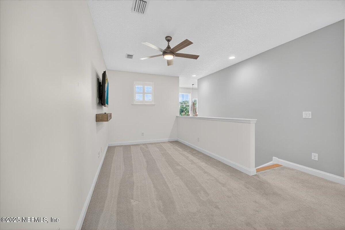 604 Timber Bridge Lane Atlantic Beach, FL 32233 - Photo 23 of 46 a view of an empty room with a window