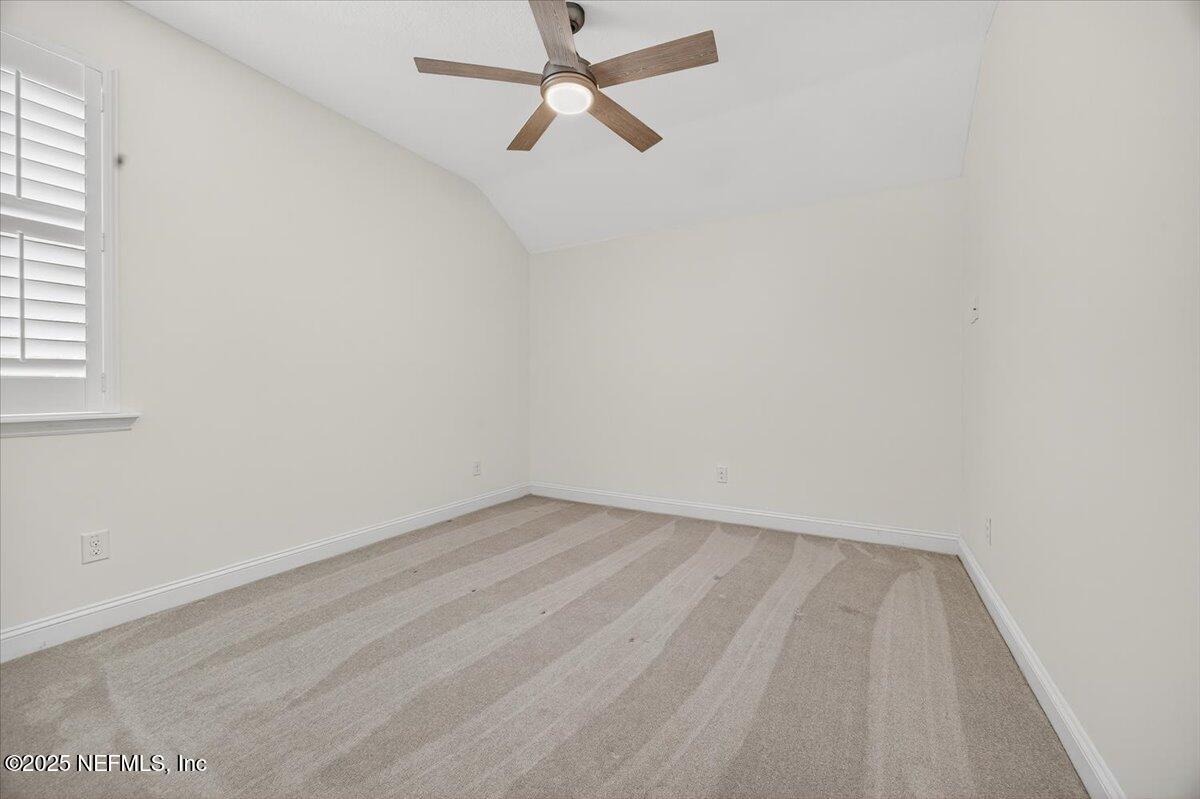 604 Timber Bridge Lane Atlantic Beach, FL 32233 - Photo 27 of 46 an empty room with a window and a fan