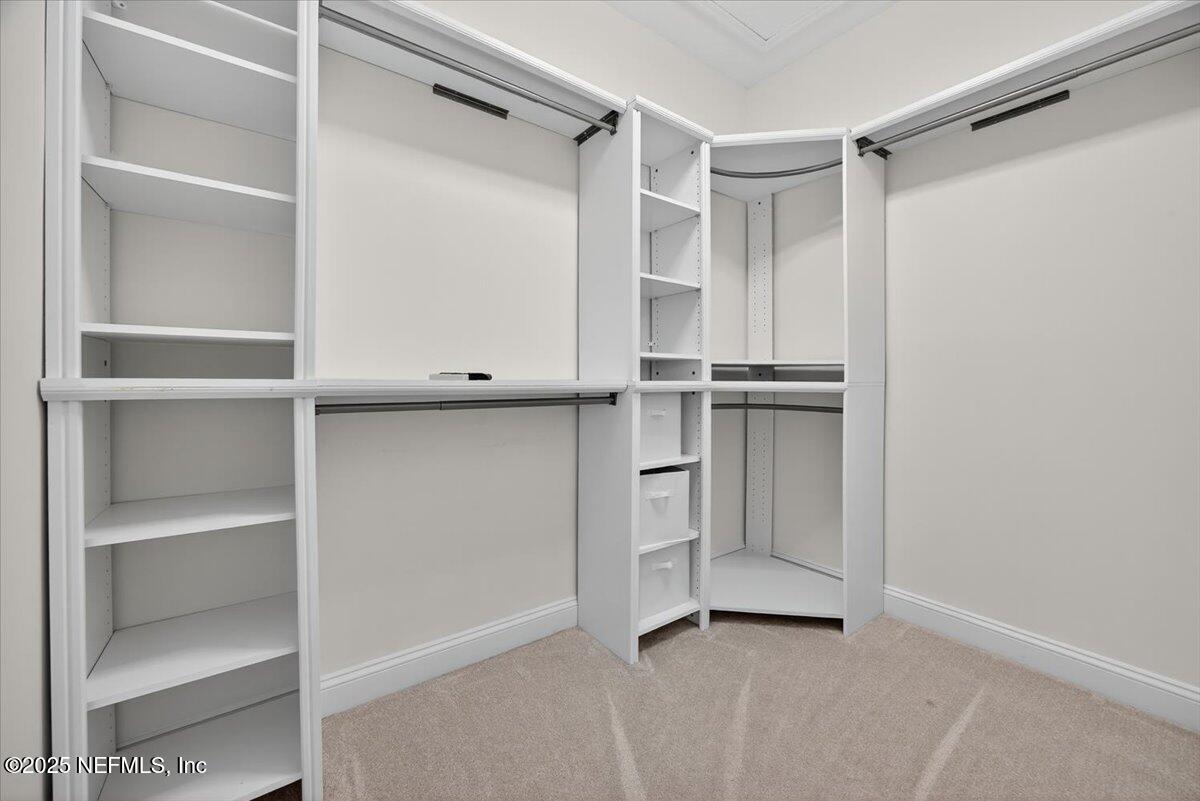 604 Timber Bridge Lane Atlantic Beach, FL 32233 - Photo 31 of 46 a view of walk in closet with empty racks