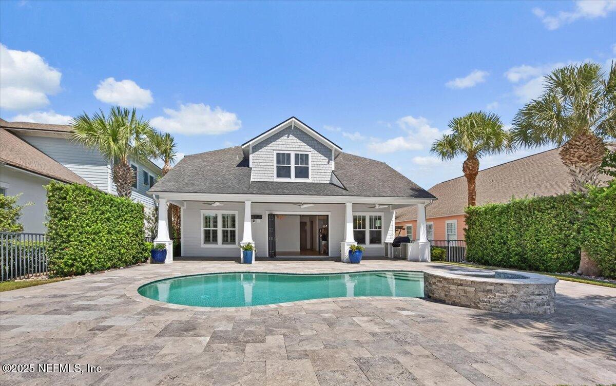 604 Timber Bridge Lane Atlantic Beach, FL 32233 - Photo 35 of 46 a front view of a house with a yard and potted plants