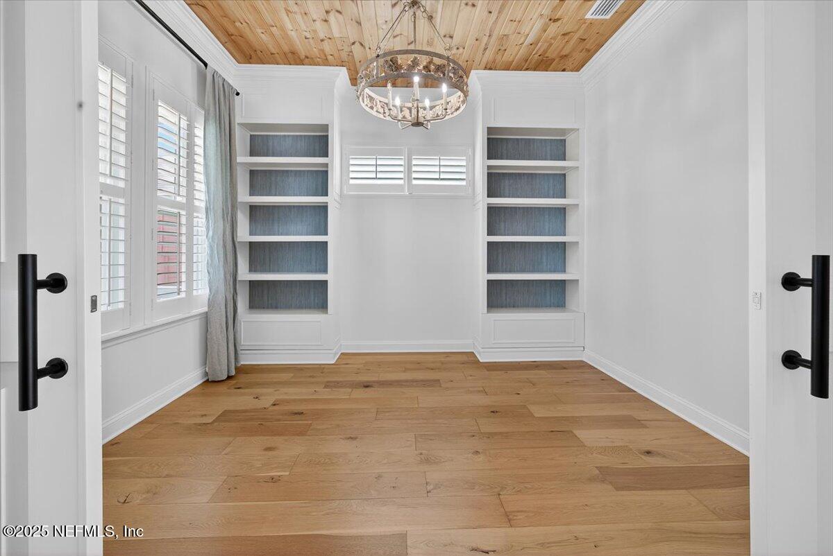 604 Timber Bridge Lane Atlantic Beach, FL 32233 - Photo 6 of 46 a view of empty room with windows and cabinet