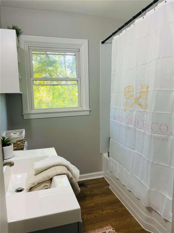 408 Reece Street Northeast Rome, GA 30161 - Photo 4 of 12 a bathroom with a sink and a window