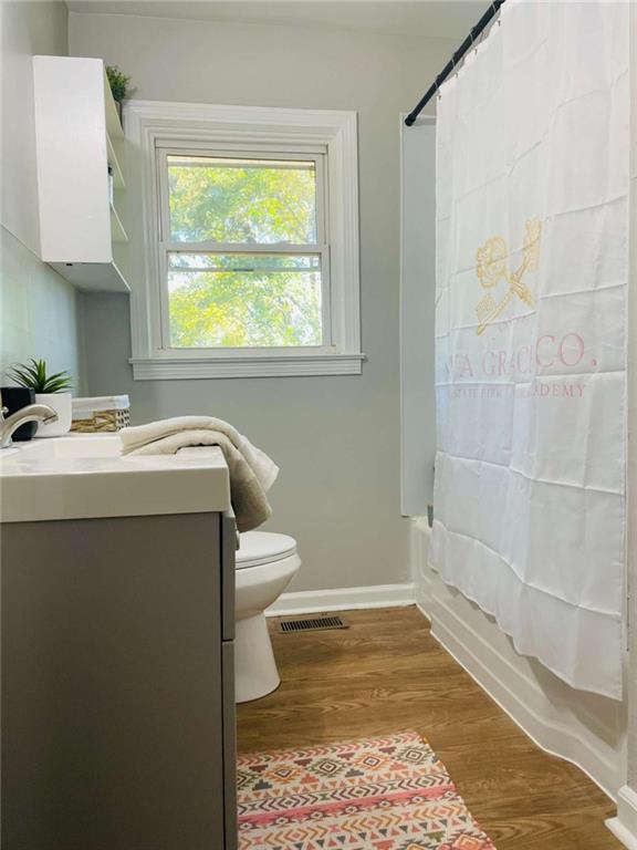 408 Reece Street Northeast Rome, GA 30161 - Photo 5 of 12 a bathroom with a sink toilet and window