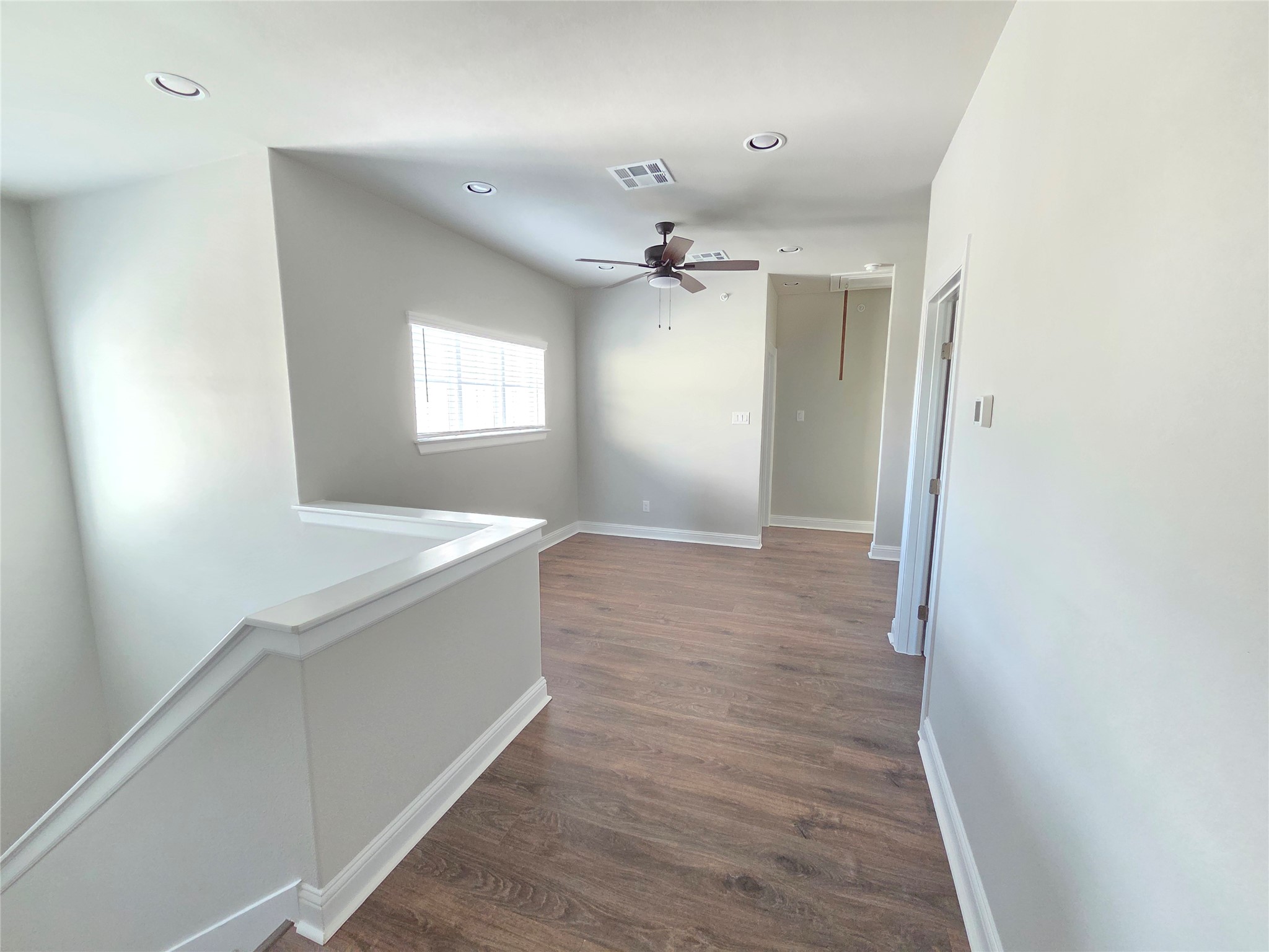 600 C-Bar Ranch Trail, Unit 121 Cedar Park, TX 78613 - Photo 20 of 32 A well-lit upper landing, featuring resilient flooring and a bright window.