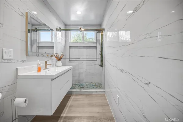 a bathroom with a bathtub and sink