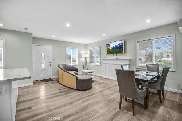 a living room with fireplace furniture and a flat screen tv