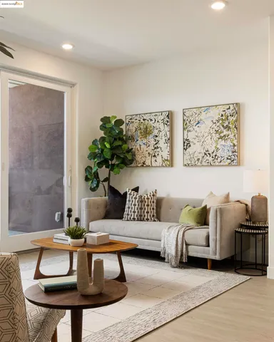 a living room with furniture and a potted plant